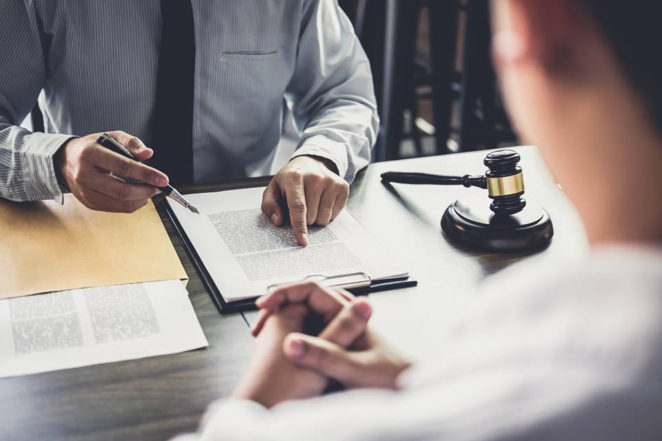 lawyer reading from a paper